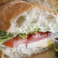 Caprese Sandwich · Fresh mozzarella, tomatoes and lettuce served on a rustic ciabatta roll with basil aioli, ol...