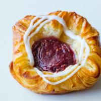 Mini Raspberry Crown · Crunchy and flaky texture filled with our special raspberry cream right on the
middle.