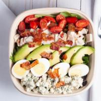 Cobb Salad · Mixed greens, roasted turkey, avocado, bacon, egg, tomatoes & blue cheese crumbles.
