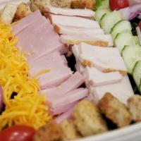Chef Salad · Premium ham, roasted turkey, swiss and cheddar cheese, mixed greens, tomatoes, red onions, c...