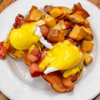 The Original Benedict · Two poached eggs and Canadian bacon on an English muffin topped with hollandaise sauce and s...