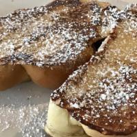 French Toast · Two slices of sweet French toast topped with powdered sugar.