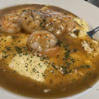 Shrimp & Grits · Shrimps sauteed in a garlic sauce served with grits.