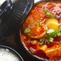 Sundubu Jjiae · Spicy soft tofu stew with choice seafood, pork, and beef.