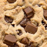 Triple Chocolate Chip · Monster cookie loaded with Hershey’s® Mini Kisses, semi-sweet chocolate chunks and milk choc...