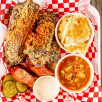 Rib Combo · 1/4 Rack of ribs and a 1/3 Pound of Another Meat, One Side, Butter Bread, B&B Pickles, and S...