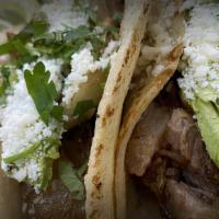 Taco · Served with onions and cilantro with lime on the side. Choice of tortilla.