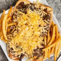 Pepito De Carne · Grilled steak, lettuce, potatoes stick, sauces and cheese. Fries on the side.