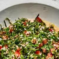 Tabouleh Salad · Finely chopped parsley, tomato, green onions, mint, crushed wheat tossed in lemon dressing.