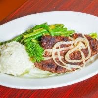 16 Oz Ny Steak · With mashed potatoes and mixed vegetables.