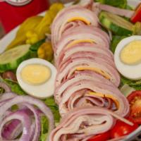 Chef Salad · Rolls of sliced ham, turkey, salami, American and provolone cheese over mixed greens, tomato...