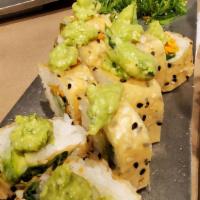 Veggie San · Soy bean sheet roll with carrots, avocado, kakiage, wakame a seaweed salad topped with aguac...