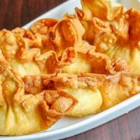 Crab Rangoon · Crispy dumpling filled with hearty crab meat.