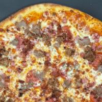 Meat Lovers · We kept a tomato sauce base for this one and literally, went ham. This meat lovers pizza is ...