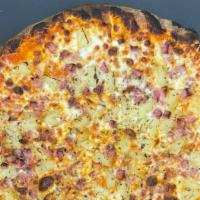 Hawaiian · A classic, tomato base pizza topped with mozzarella, ham & pineapple