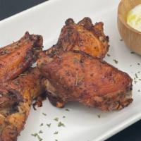 Wings (6) · Fire grilled to perfection, topped with your choice of sauce