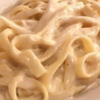 Fettucine Alfredo · Includes tossed salad or soup and garlic rolls.