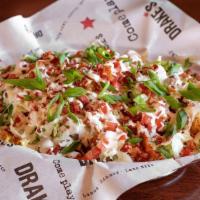 Blt Tots · Crispy Tater tots layered with creamy ranch dressing and warm smoky bacon, topped with crisp...