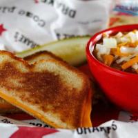 Hearty Chili W/ Grilled Cheese · Made from scratch with beef (seriously, a lot of beef) and beans, topped with cheese and dic...