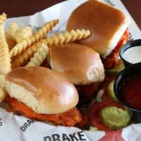 Buffalo Chicken Minis · Three hand-breaded chicken sandwiches spun in buffalo sauce with ranch or blue cheese.