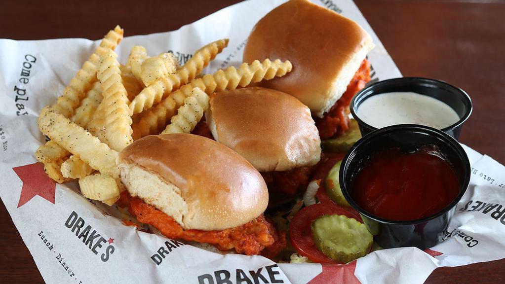 Buffalo Chicken Minis · Three hand-breaded chicken sandwiches spun in buffalo sauce with ranch or blue cheese.