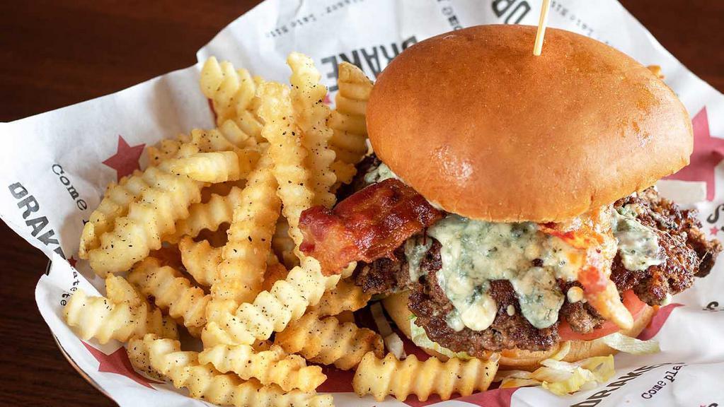 Big Blue Burger · Cajun spice, blue cheese crumbles and dressing, bacon, fresh cut toppings.