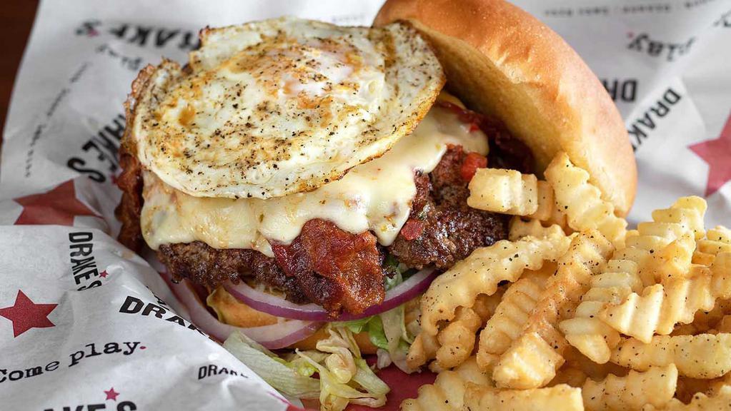 Morning Glory Burger · Pepper jack cheese, fried egg, bacon, fire-roasted salsa, fresh cut toppings.