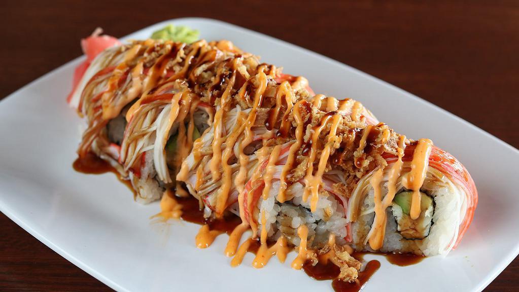 Crunchy Texas Roll · Seared white tuna, avocado, seaweed; topped with crab, fried onion, sushi sauce and spicy mayo.