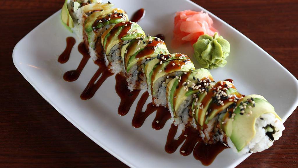 Dragon Roll · Cooked eel, cucumber, seaweed, sushi sauce; wrapped in avocado and sesame seeds.