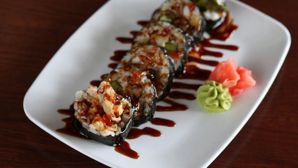 Soft Shell Crab Roll · Tempura soft shell crab, lettuce, avocado, seaweed; topped with sushi sauce and sweet chili sauce.