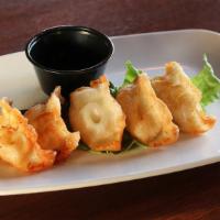 Dumplings · Choice of pork, chicken, shrimp or spicy beef with Asian vegetables; fried and served with a...