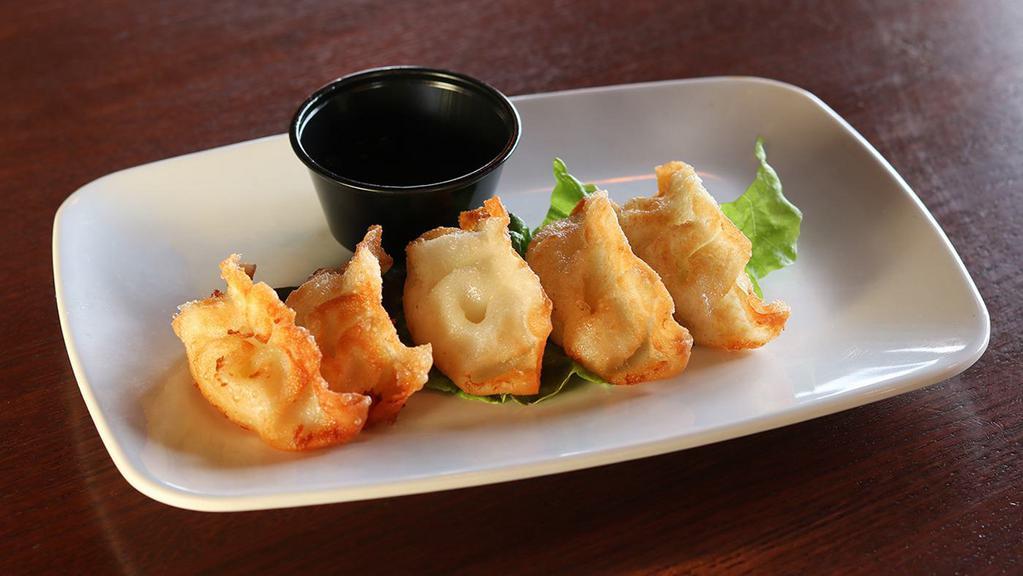 Dumplings · Choice of pork, chicken, shrimp or spicy beef with Asian vegetables; fried and served with aqua sauce.