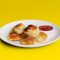 Garlic Knots · Garlic knots with side of marinara.