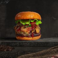 Smoked Cookout Burger · Seasoned plant-based patty topped with melted vegan cheese, barbecue sauce, lettuce, tomato,...