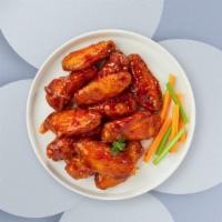Buffed Buffalo Chicken Wings · Fresh chicken wings breaded, fried until golden brown, and tossed in buffalo sauce. Served w...