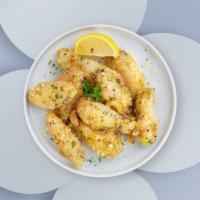 Properly Garlic Parmesan Wings · Fresh chicken wings breaded, fried until golden brown, and tossed in garlic and parmesan. Se...