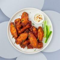 Classic Manic Chicken Wings · Fresh chicken wings breaded and fried until golden brown. Served with a side of ranch or ble...