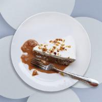 Turtle Cheese Cake · An ultra-rich cheesecake topped with caramel, chocolate and pecans.