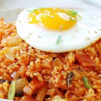 Kimchi Fried Rice · Spicy. Kimchi Fried Rice with Sunny Side Up Egg. Served with two Daily side dishes include k...