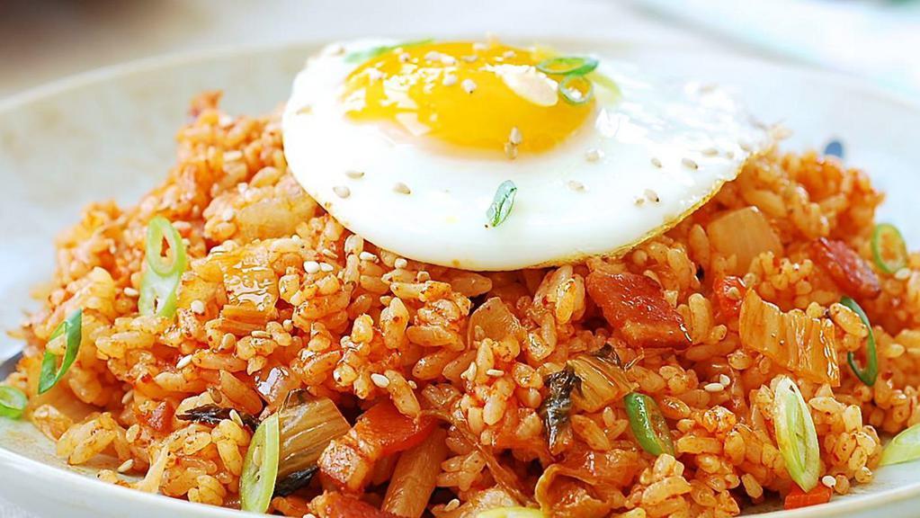 Kimchi Fried Rice · Spicy. Kimchi Fried Rice with Sunny Side Up Egg. Served with two Daily side dishes include kimchi and one extra side dish of choice.
