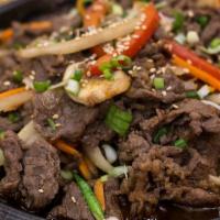 Beef Bulgogi · Savory sweet marinated ribeye beef. Comes with rice and two side dishes. One Kimchi and anot...