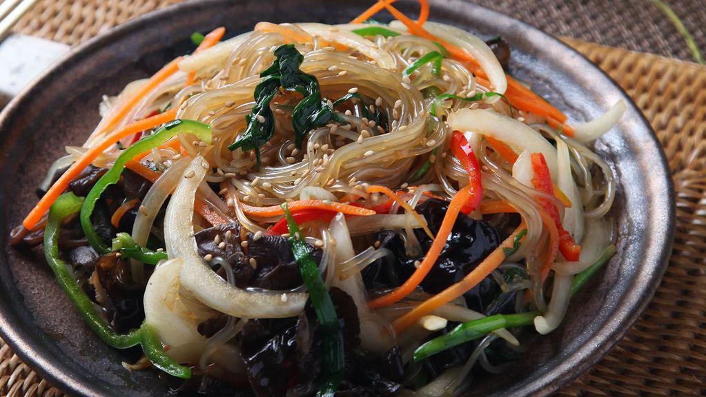 Japchae · Stir fried clear sweet potato noodles with seasonal Korean vegetables and beef. Served with a side of rice and served with two daily side dishes include kimchi and one extra side dish of choice.