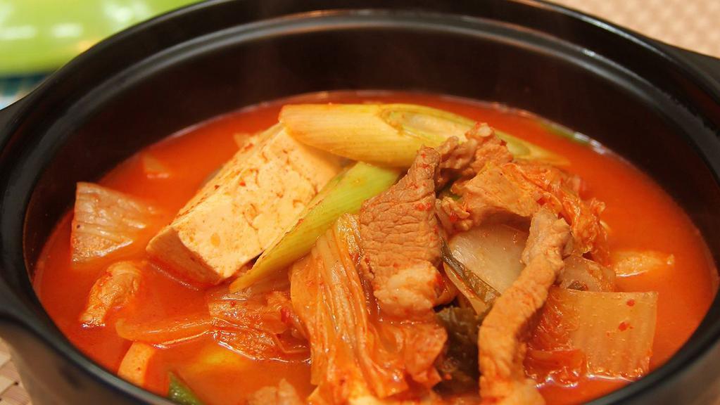 Kimchi Jigae/Kimchi Stew · Spicy Kimchi Stew tofu and pork. Comes with Rice and Served with two Daily side dishes include kimchi and one extra side dish of choice.