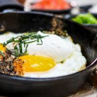 Huevos Polanco · Contains sprouts and sesame seeds. Two sunny side up eggs in Parmesan cheese crusts with a d...