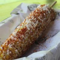 Mexican Street Corn (Saturday & Sunday) · Corn on the cobb topped with mayonnaise, queso fresco, and a blend of Mexican Spices.