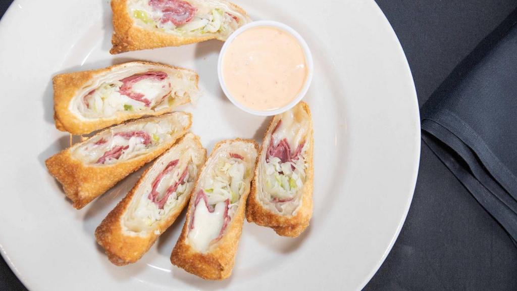 Irish Spring Rolls · Wontons stuffed with lean corned beef, cabbage and Swiss cheese. Served with a side of 1,000 Island Dressing.