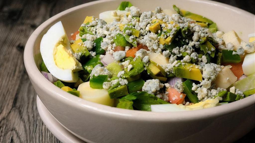 Chopped Salad · Crisp fresh cut romaine, tossed with heart of palm, tomato, avocado, chick peas, red onion, sliced egg, green pepper and gorgonzola cheese in a lemon basil vinaigrette.