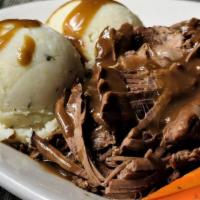Pot Roast · Home style favorite! Tender beef, slow cooked with onions, carrots & celery, served with mas...