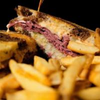 Reuben · Grilled lean corned beef with sauerkraut, melted Swiss cheese and Thousand Island dressing o...