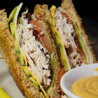 Turkey Avocado Club · Slow roasted turkey breast piled high on toasted 8 grain bread with Creole Honey mustard. To...